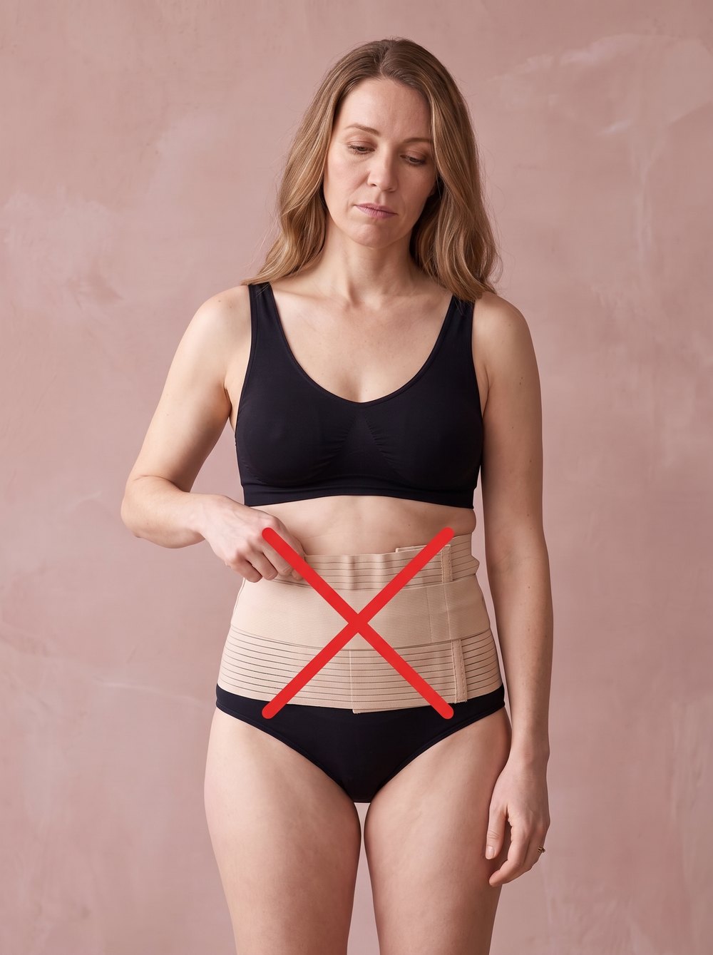 Mom unhappy in an ordinary postpartum belly band